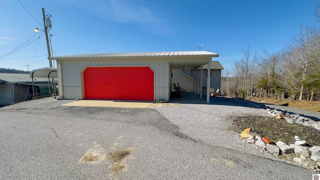 manufactured / mobile home featuring metal roof and a carport