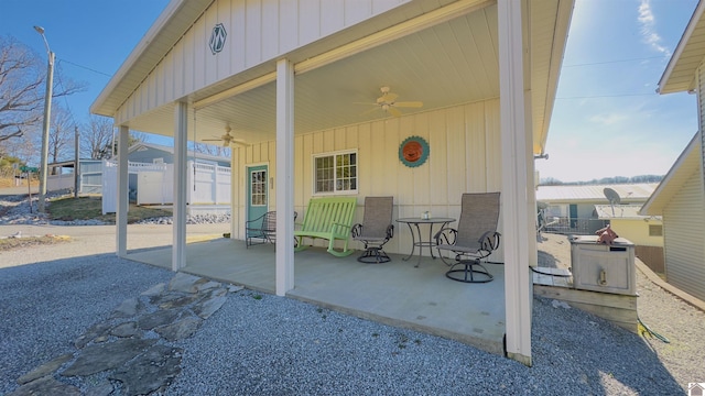 view of patio / terrace with a ceiling fan and fence