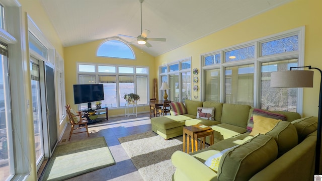 sunroom / solarium with lofted ceiling and a ceiling fan