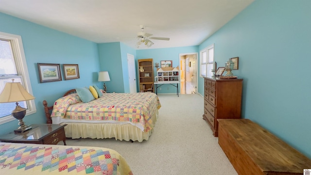 carpeted bedroom featuring ceiling fan