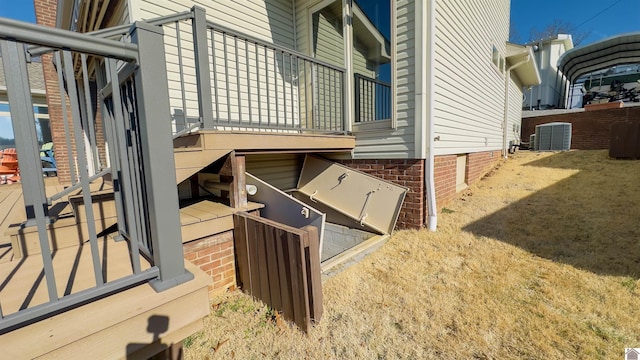 view of property exterior featuring a carport and central AC unit