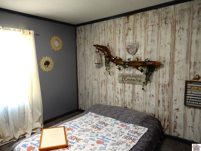 bedroom featuring wallpapered walls, baseboards, and ornamental molding