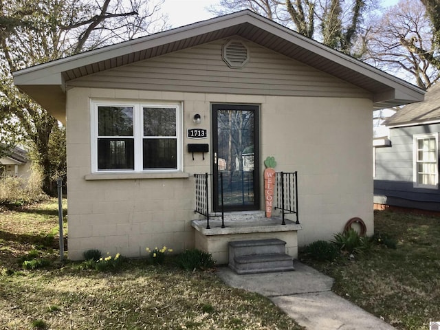 view of front of property featuring concrete block siding