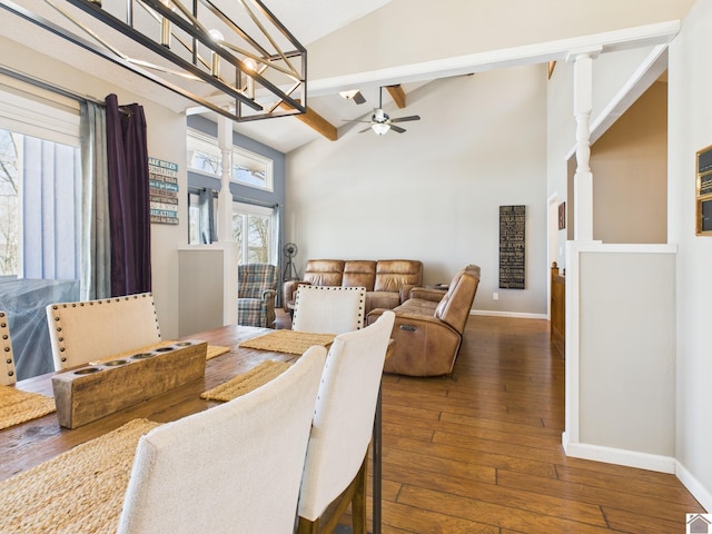 dining area with beam ceiling, baseboards, ceiling fan, and hardwood / wood-style floors