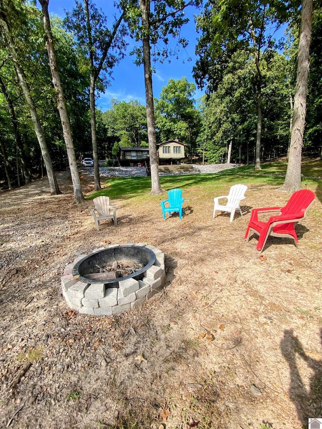 view of yard featuring an outdoor fire pit