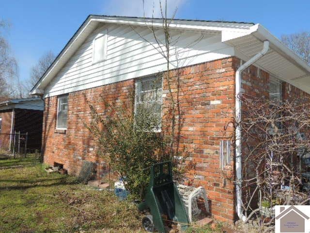 view of home's exterior featuring brick siding