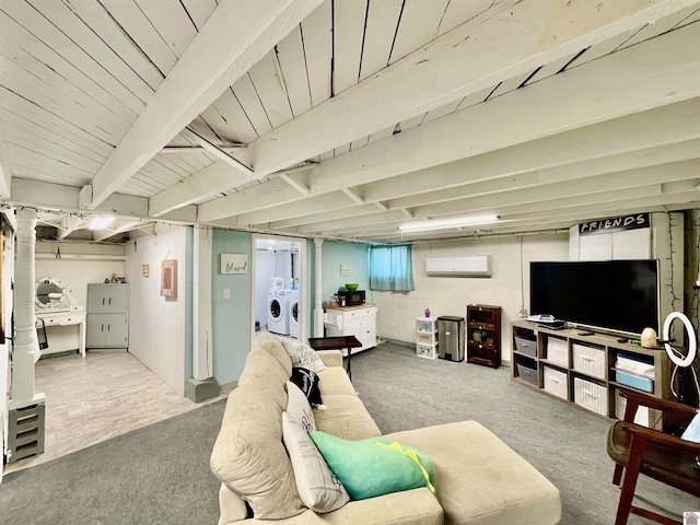 living room with carpet floors, washing machine and dryer, and a wall mounted air conditioner