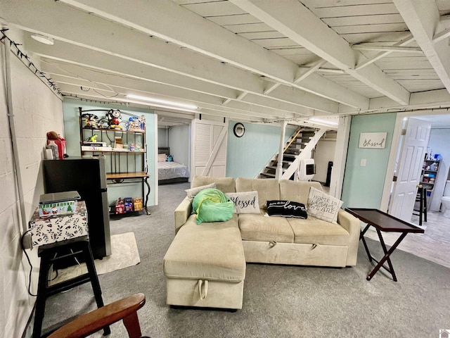 living room with carpet and stairs