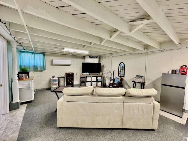 living area with concrete block wall and a wall mounted AC