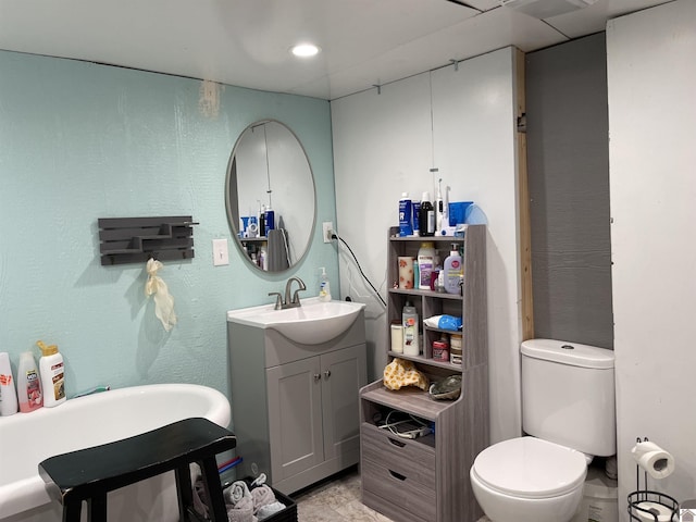 bathroom featuring toilet and vanity