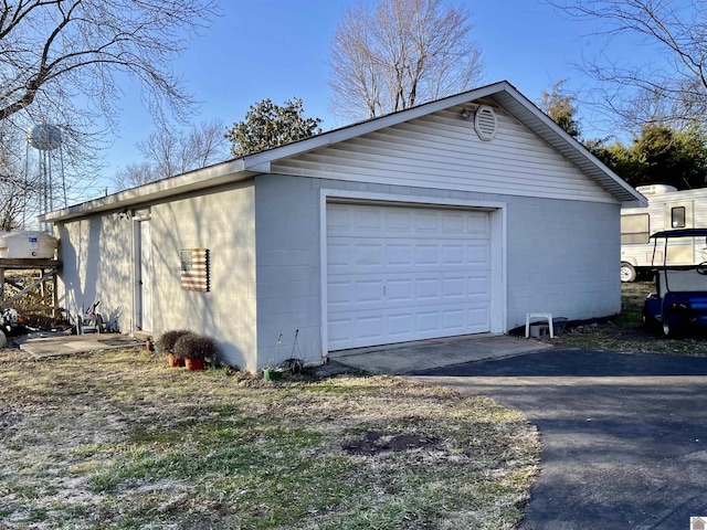 detached garage featuring driveway