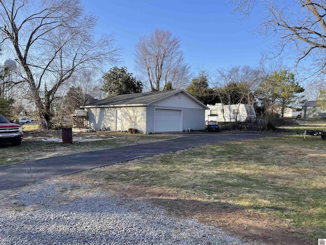 detached garage featuring driveway