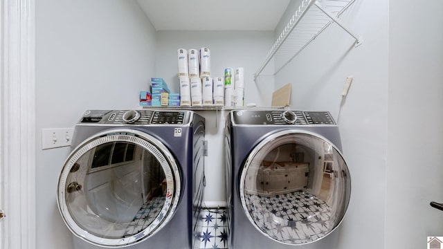 laundry area featuring independent washer and dryer and laundry area