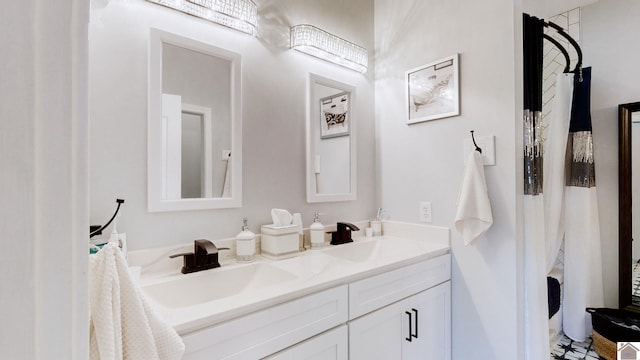 bathroom with a sink and double vanity