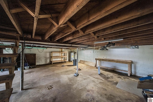 unfinished basement with electric water heater