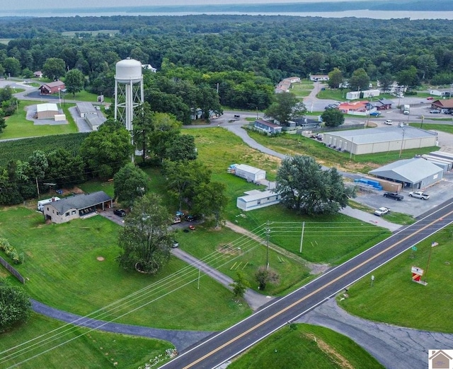 birds eye view of property featuring a wooded view