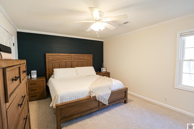 bedroom with crown molding, multiple windows, light colored carpet, and visible vents