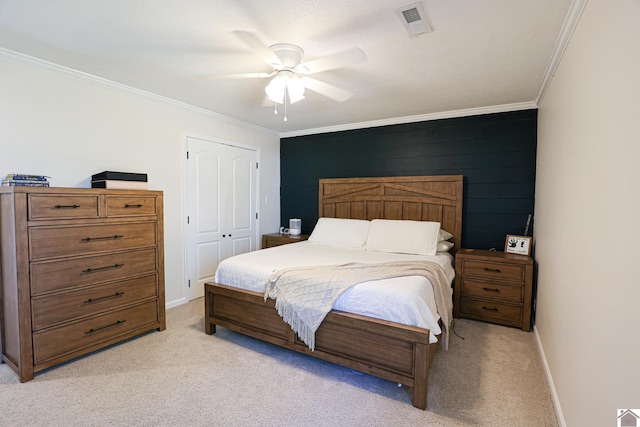 bedroom with light carpet, visible vents, baseboards, and ornamental molding