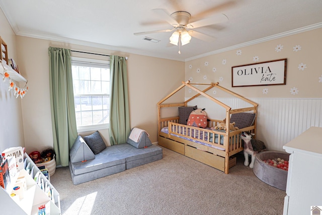 bedroom featuring visible vents, ornamental molding, and carpet flooring