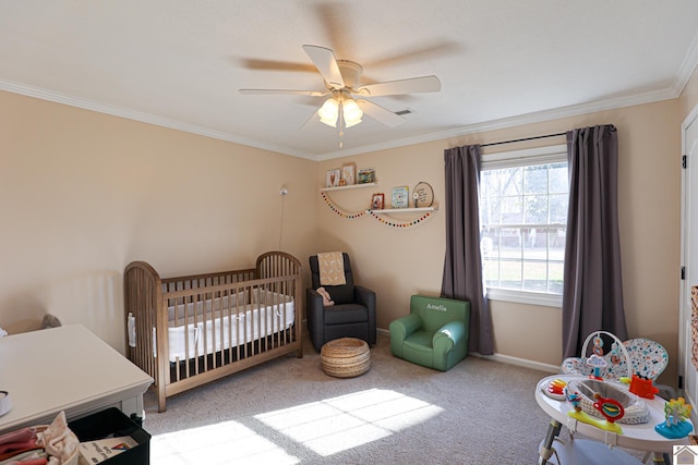 bedroom with ceiling fan, baseboards, ornamental molding, carpet flooring, and a nursery area