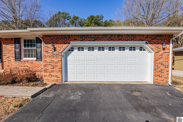 garage featuring driveway