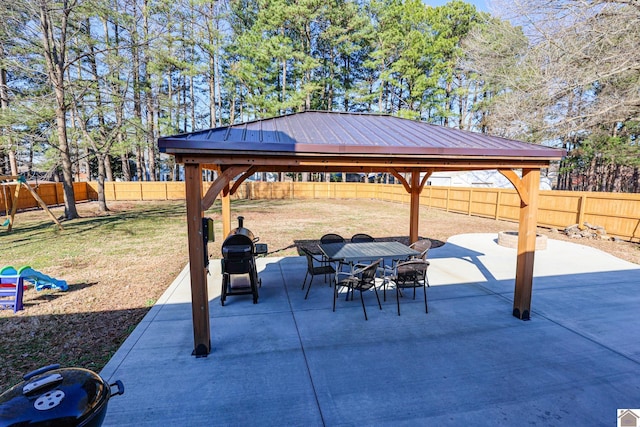 view of patio featuring a gazebo, outdoor dining area, area for grilling, and a fenced backyard