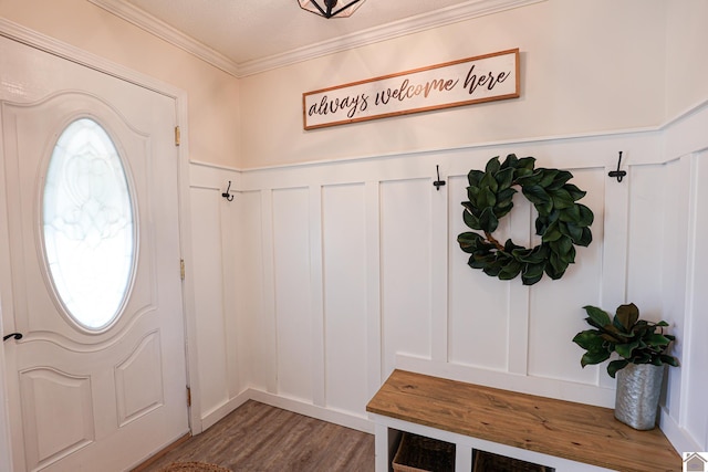 mudroom with a decorative wall, wood finished floors, and ornamental molding