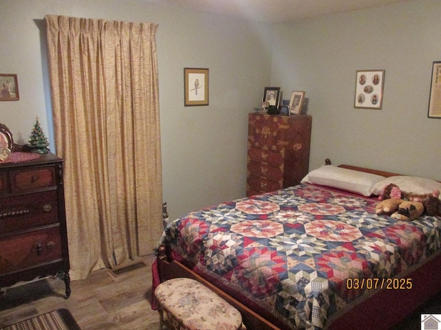 bedroom featuring wood finished floors