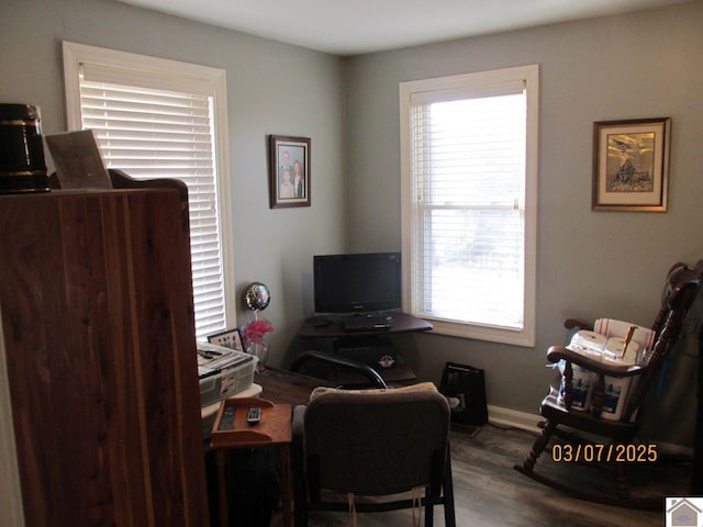 office area featuring baseboards and wood finished floors