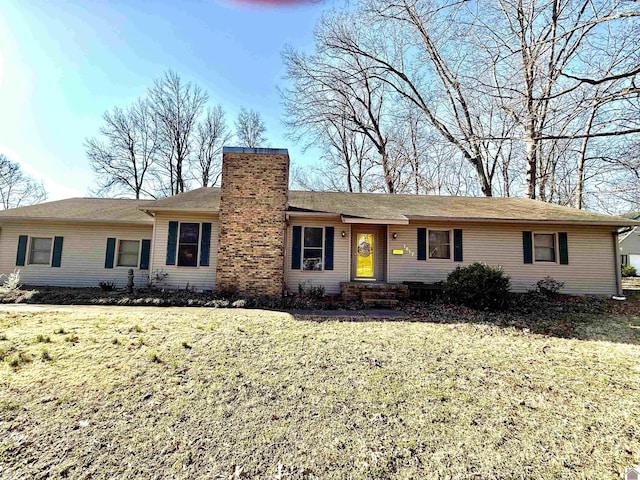 ranch-style home with a chimney