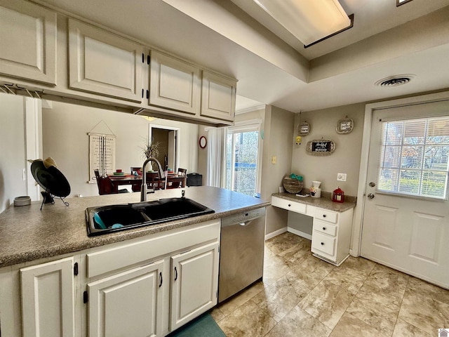 kitchen with a sink, visible vents, dishwasher, and white cabinets