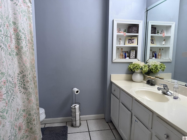 full bath featuring baseboards, toilet, vanity, and tile patterned flooring