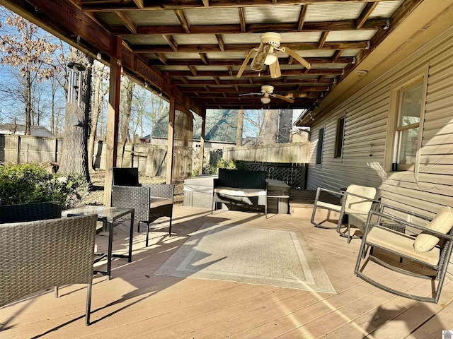 view of patio / terrace featuring an outdoor living space, outdoor dining area, ceiling fan, and fence