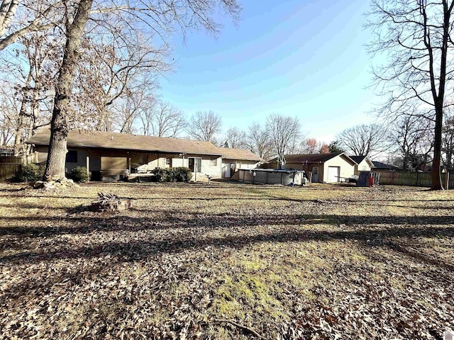 rear view of house with fence