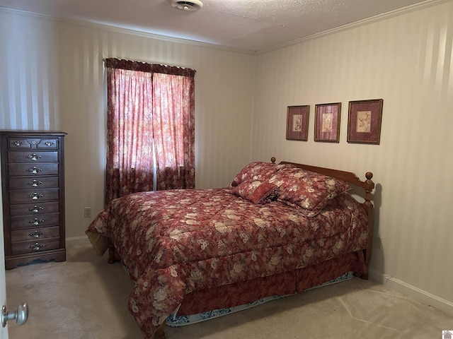 bedroom with carpet, baseboards, and ornamental molding