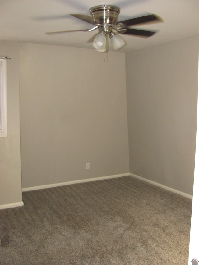 carpeted empty room with baseboards