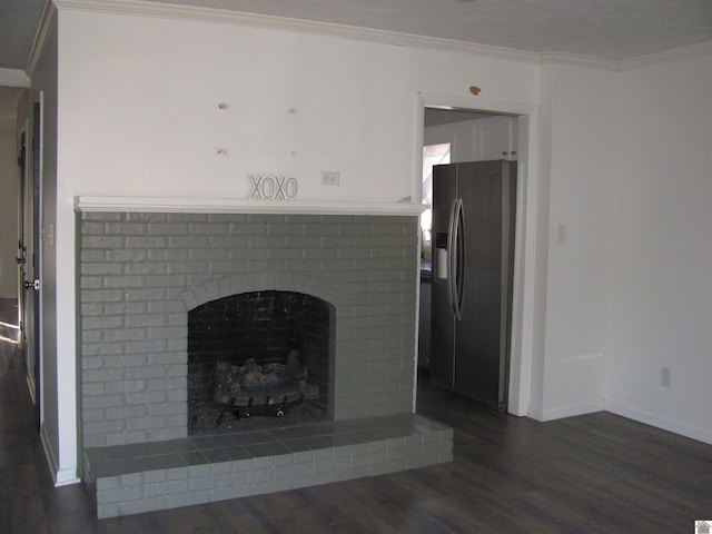 unfurnished living room featuring dark wood finished floors, a brick fireplace, baseboards, and ornamental molding