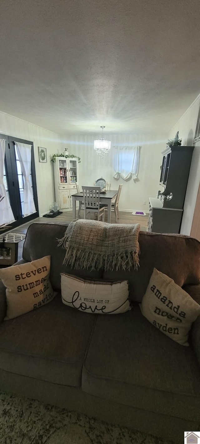 living area featuring an inviting chandelier