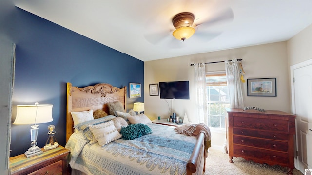 carpeted bedroom featuring a ceiling fan