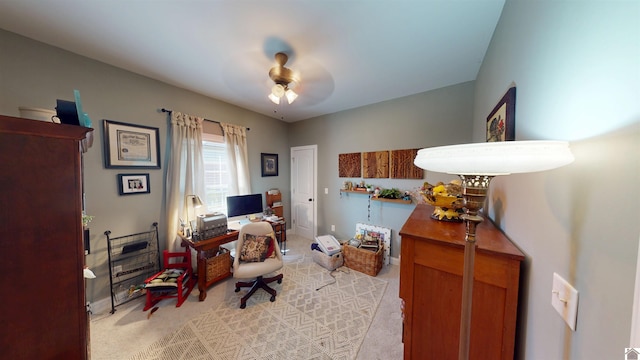 office area with light carpet and ceiling fan