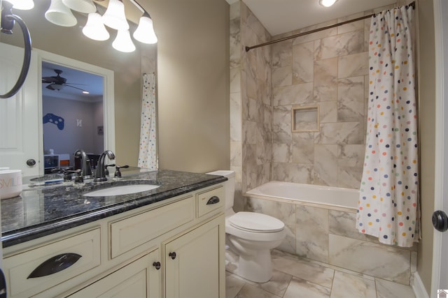 full bath featuring vanity, ceiling fan, toilet, tiled shower / bath, and marble finish floor