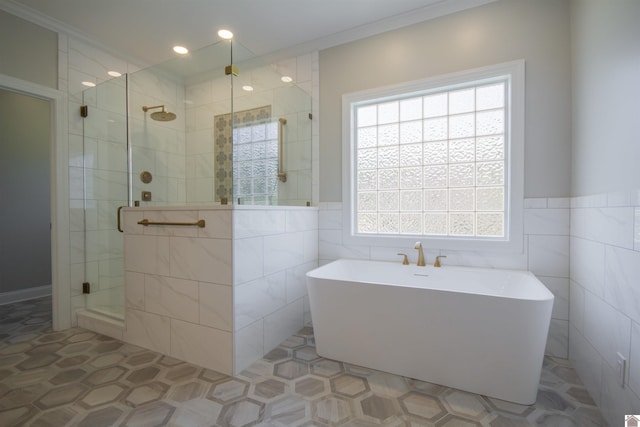 165 Valor Ct, Paducah, KY 42003 - bathroom with tile walls, a shower stall, a freestanding bath, and crown molding