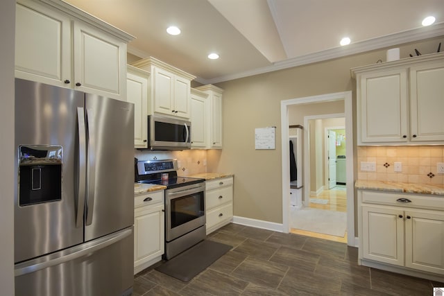 kitchen with light stone countertops, tasteful backsplash, appliances with stainless steel finishes, and crown molding