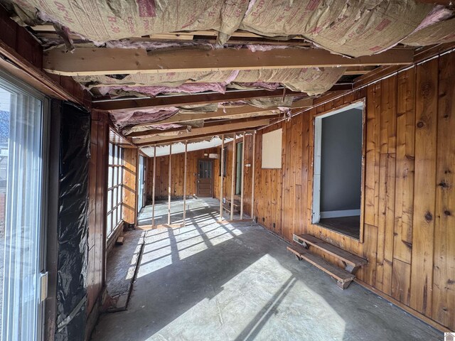 miscellaneous room with wooden walls