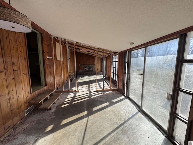 interior space with visible vents and vaulted ceiling