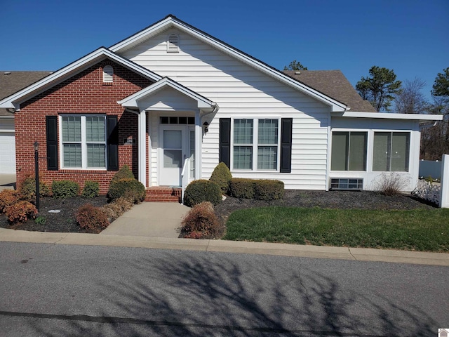 view of front of home with brick siding