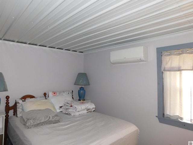 bedroom featuring an AC wall unit