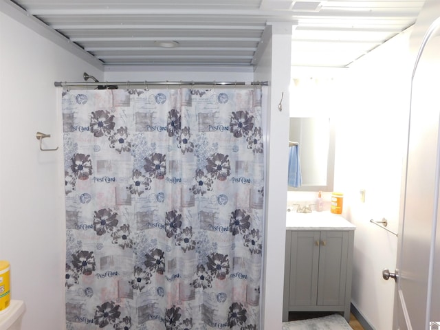 full bathroom featuring vanity and a shower with curtain