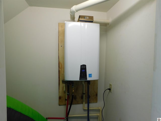 utility room featuring water heater