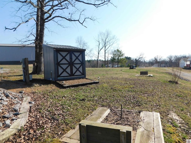 view of yard with a storage shed and an outbuilding